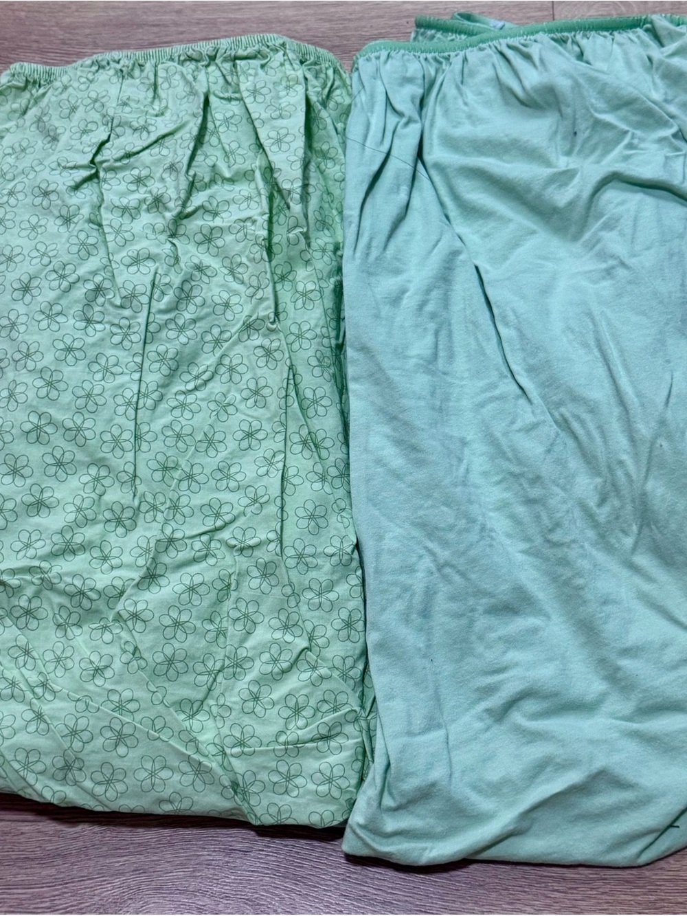 Two (2)  Green Fitted Crib Sheets - Floral & Solid